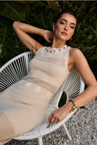 Cowrie shell open knit fringe maxi dress by RARA Boutique, featuring a flowing design with shell accents and fringe details.