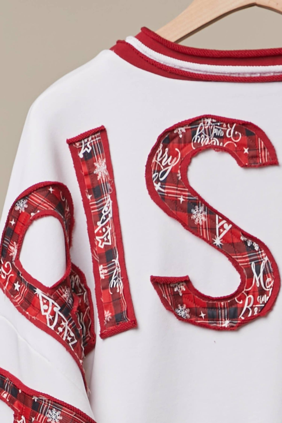 Mello Tuesday Holiday Merry Christmas letter sweatshirt featuring festive red and white design, cozy sweater for Christmas celebrations.