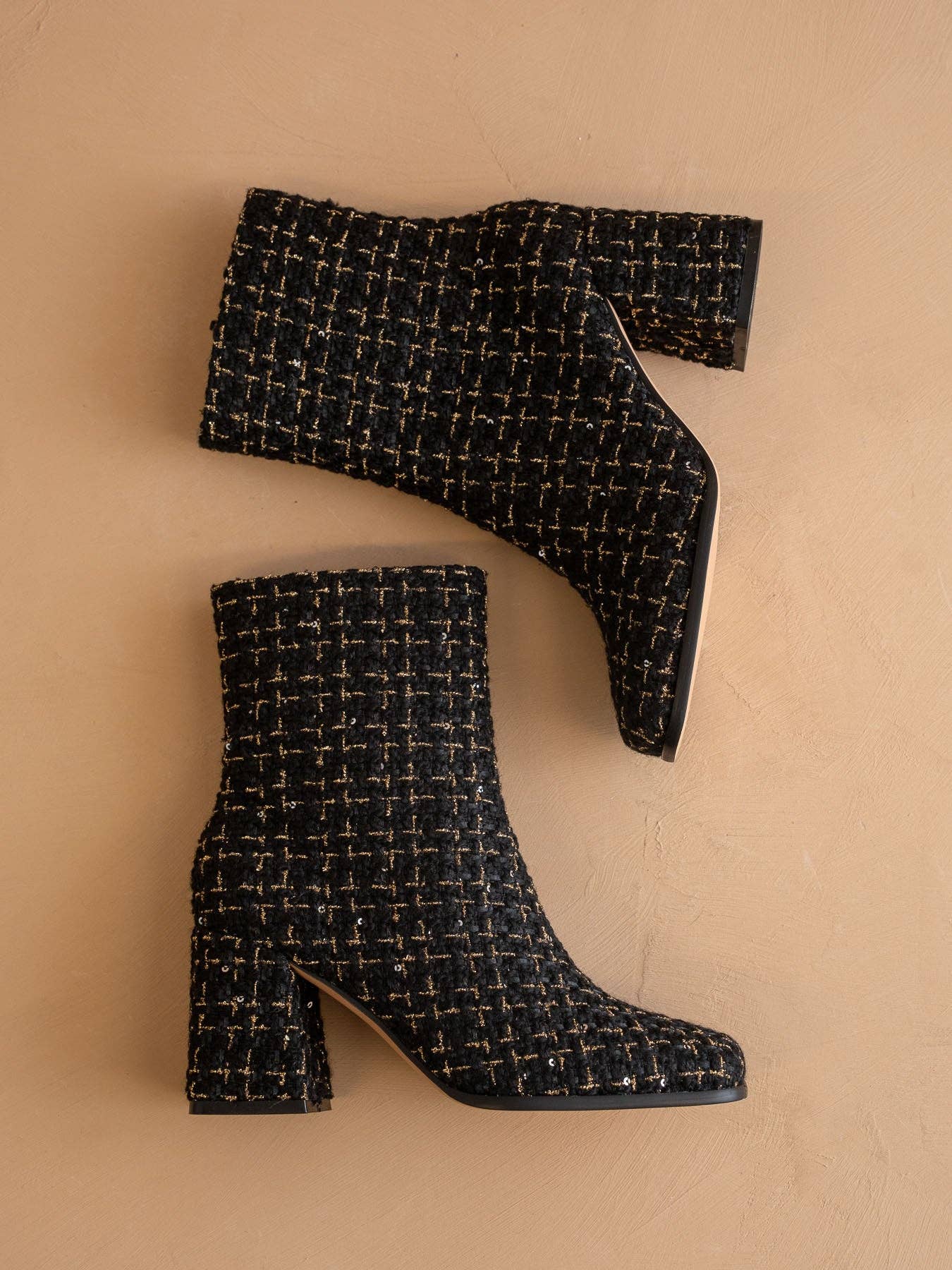 Black tweed woven block heel ankle boot from Oasis Society with a stylish fall design and sturdy heel.