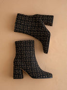 Black tweed woven block heel ankle boot from Oasis Society with a stylish fall design and sturdy heel.
