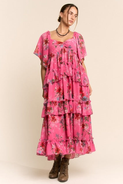 Floral tiered ruffle maxi dress with flutter sleeves by RARA Boutique, featuring a flowy, bohemian style and vibrant floral pattern.