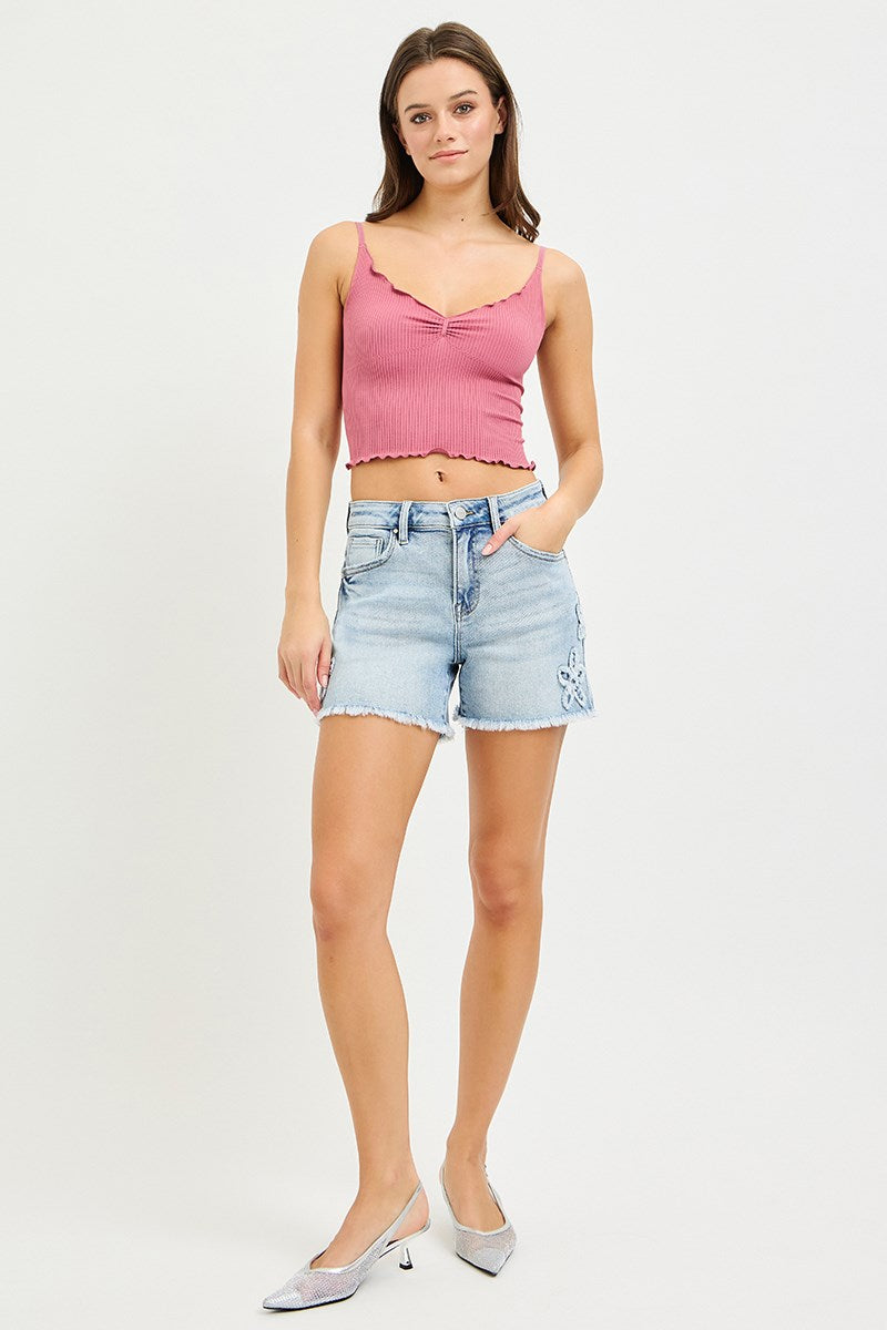 Risen floral patch high rise denim shorts with distressed details and frayed hem, stylish summer shorts for women.