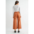 High-rise wide crop patch pocket jeans by Mica Denim, featuring distressed details and classic denim texture.