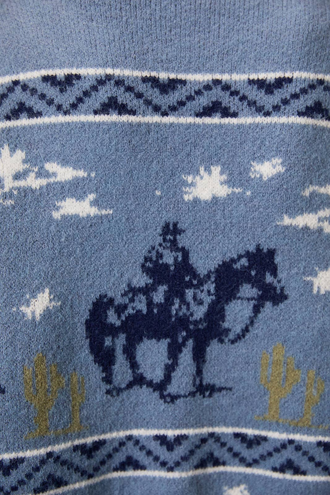 LE LIS long sleeve crew neck cowboy graphic sweater featuring a detailed Western-inspired design on soft knit fabric.