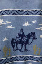 LE LIS long sleeve crew neck cowboy graphic sweater featuring a detailed Western-inspired design on soft knit fabric.