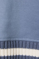 Le Lis sweatshirt featuring knit sweater sleeves, casual long-sleeve top with contrasting knit detail for cozy style.