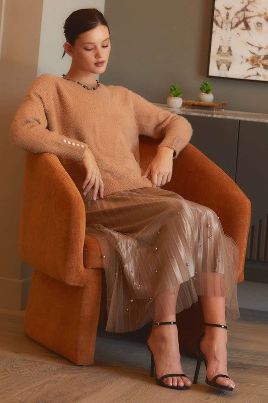 Pearl-embellished pleated mesh midi skirt from RARA Boutique, featuring intricate pleats and elegant pearl details.