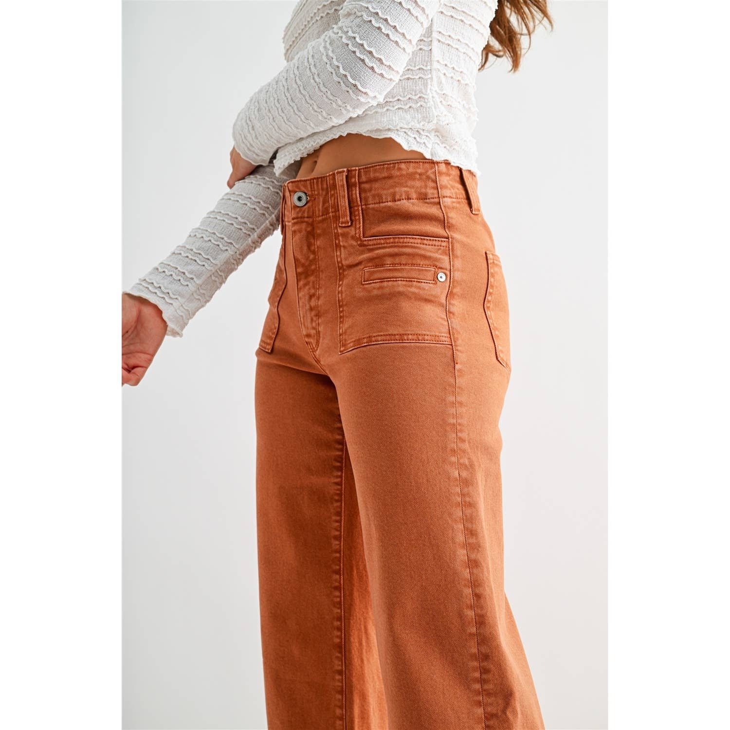 Mica Denim high-rise wide crop jeans with patch pockets, showcasing the fit and stylish design of the denim.