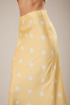 RARA Boutique polka dot satin maxi skirt with elastic waistband, flowing design and stylish polka dot pattern.