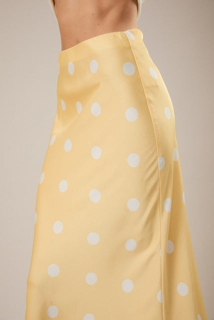 RARA Boutique polka dot satin maxi skirt with elastic waistband, flowing design and stylish polka dot pattern.
