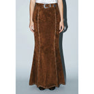 Skylar Rose suede studded maxi skirt, featuring a flowing silhouette with metal stud embellishments, styled on a model.