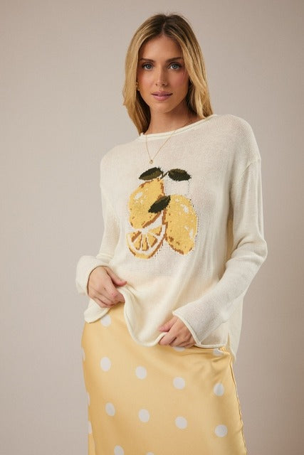 RARA Boutique Lemon Graphic lightweight knit sweater with bright yellow lemon print, long sleeves, casual style, and ribbed cuffs.