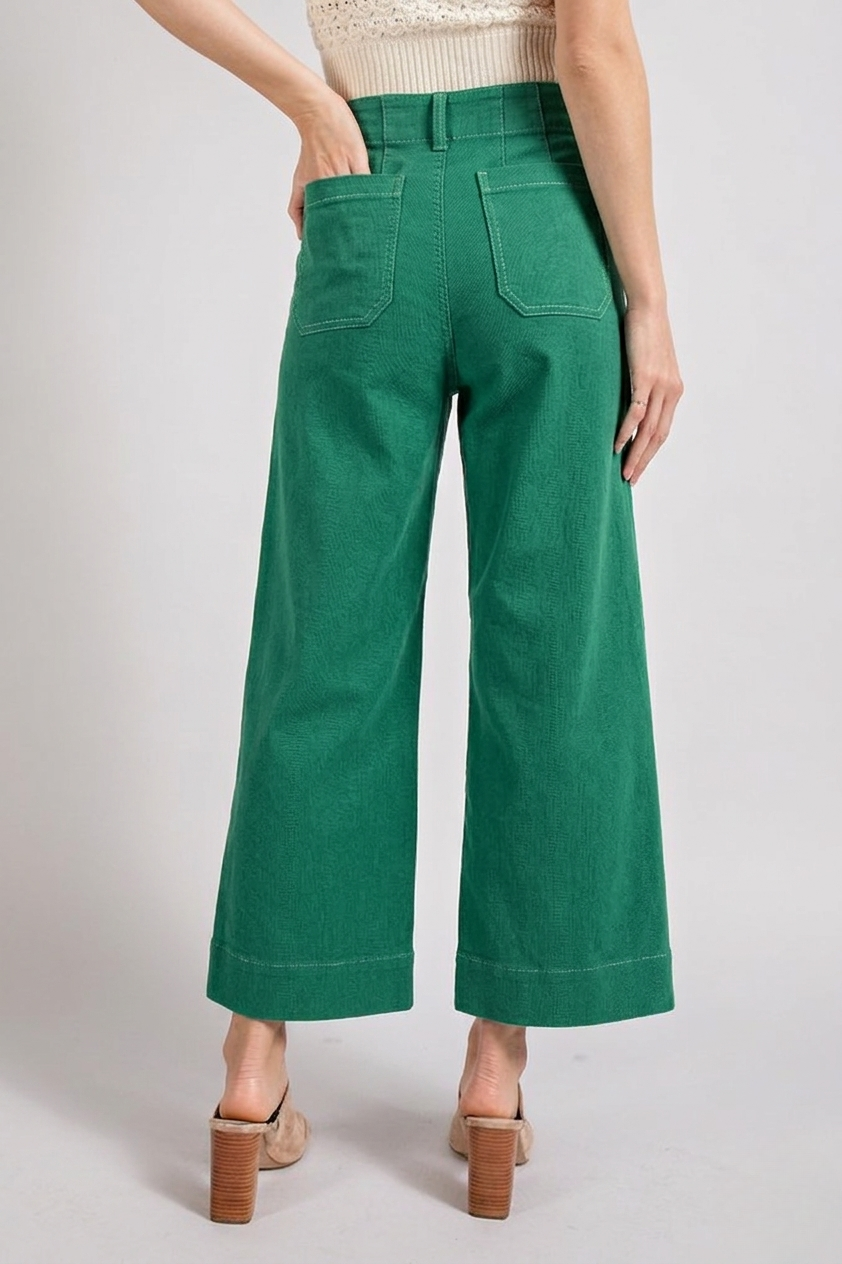Light blue soft wash wide leg jeans from RARA Boutique with a relaxed fit and high waist, displayed on a hanger.