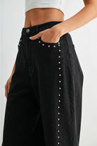 RARA Boutique studded ultra wide leg washed jeans with distressed details, showcasing a relaxed fit and edgy style.