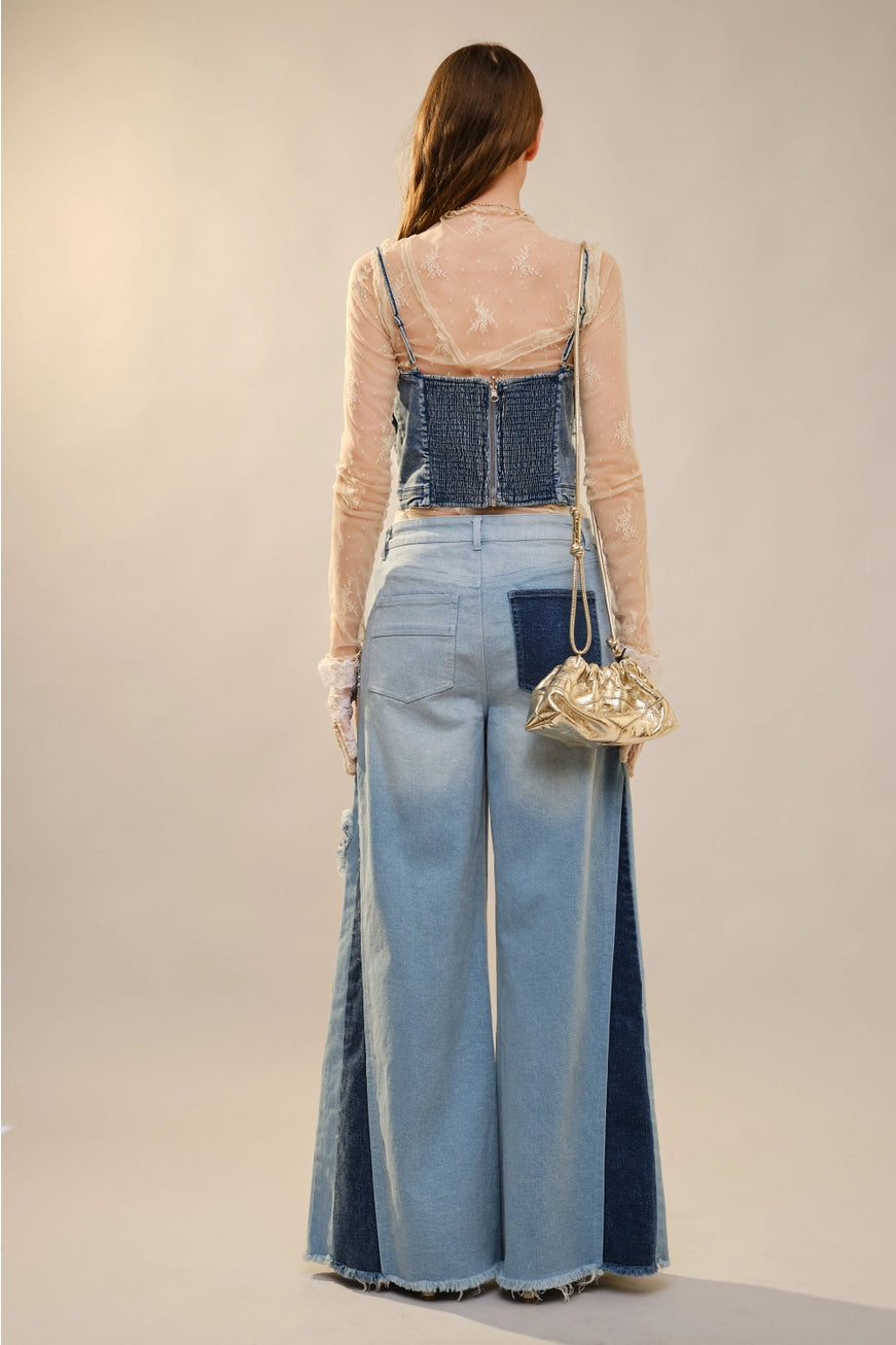 Blue butterfly embellished denim corset blouse from RARA Boutique, featuring detailed butterfly accents and a fitted denim design.