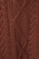 LE LIS oversized cropped cable knit sweater in cozy textured knit, shown in a relaxed fit with a high neckline and long sleeves.