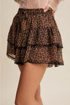 Leopard tiered ruffle lace trim skort by RARA Boutique, featuring a stylish leopard print with ruffles and lace details.