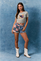 American Flag patchwork denim shorts by RARA Boutique featuring distressed denim and patriotic flag designs.