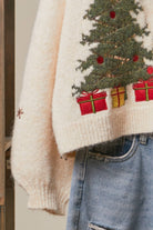 Mello Christmas Tree embroidered soft cardigan featuring festive holiday design and cozy knit fabric on a model.