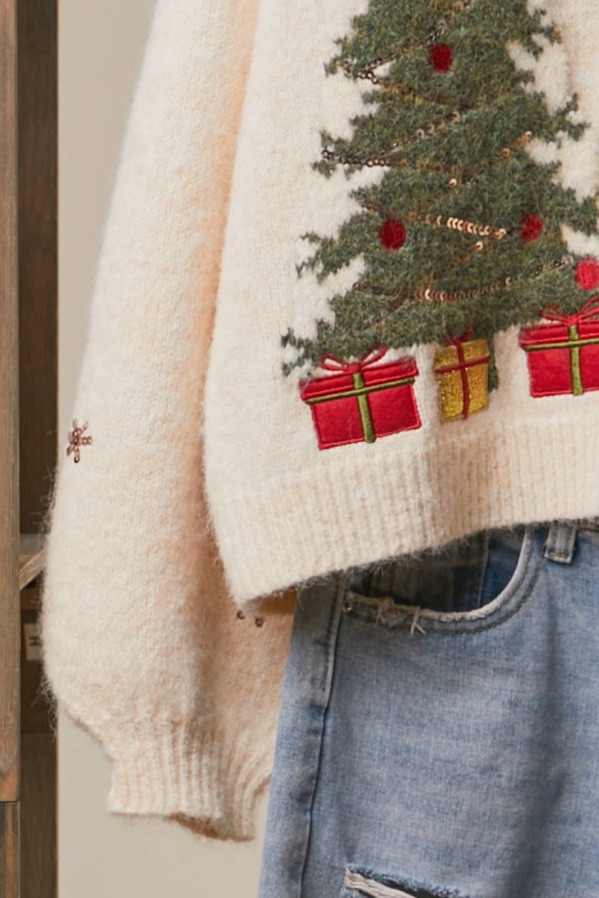 Mello Christmas Tree embroidered soft cardigan featuring festive holiday design and cozy knit fabric on a model.