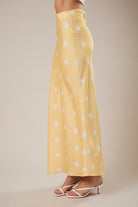 RARA Boutique polka dot satin maxi skirt with elastic waist, flowing design and stylish pattern suitable for casual or dressy wear.