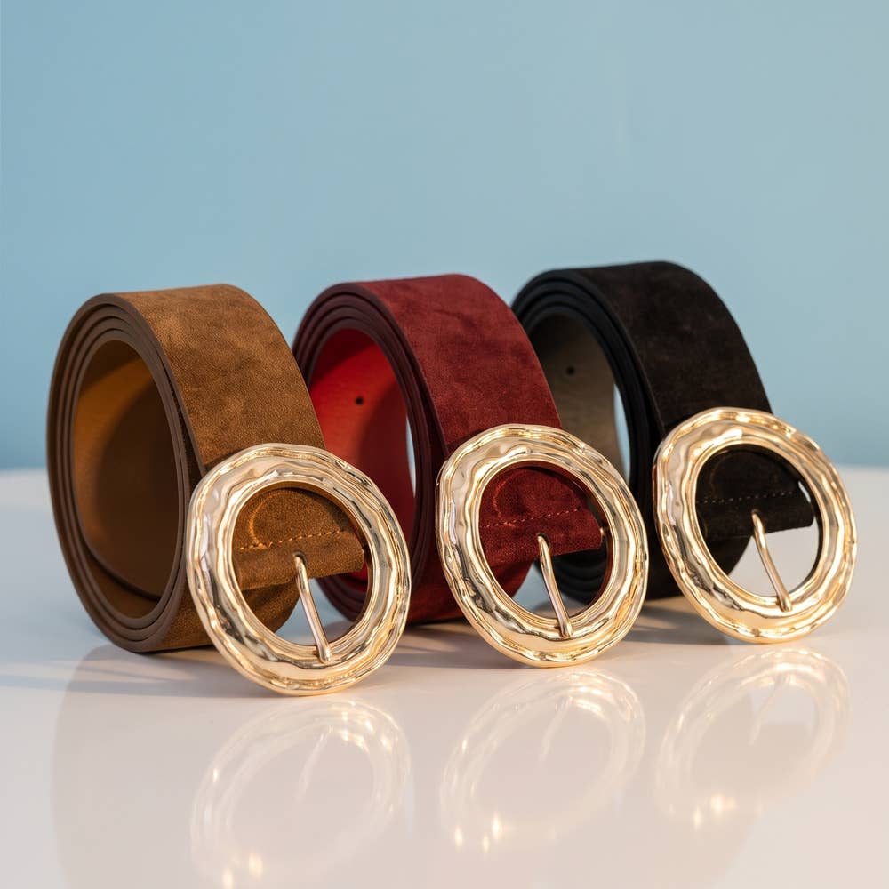 Suede hammered round buckle belt by Collections by Fame Accessories, featuring a textured leather strap and metal buckle detail.