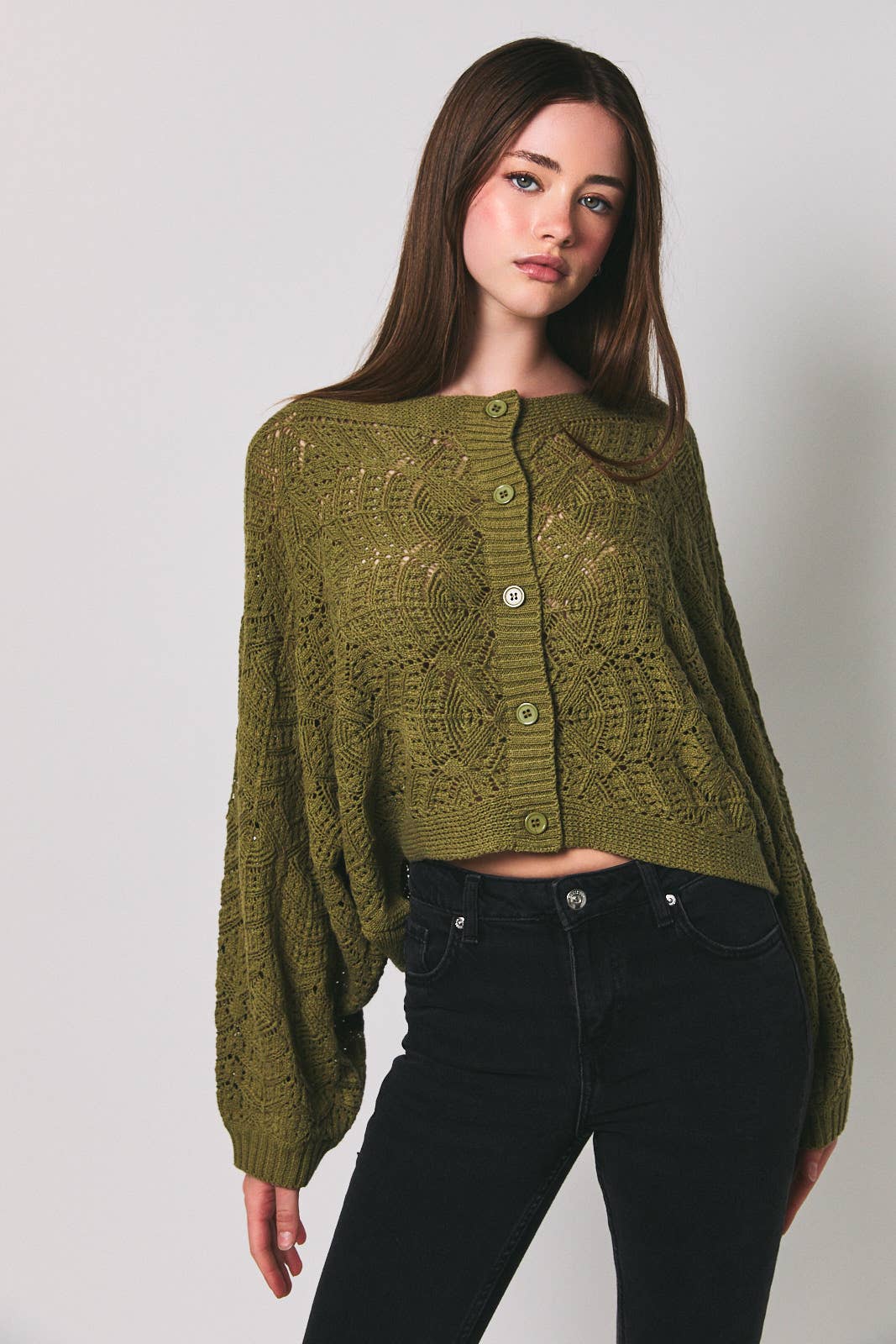 Le Lis long sleeve crochet cardigan with intricate knit pattern, lightweight and stylish for casual or layered wear.