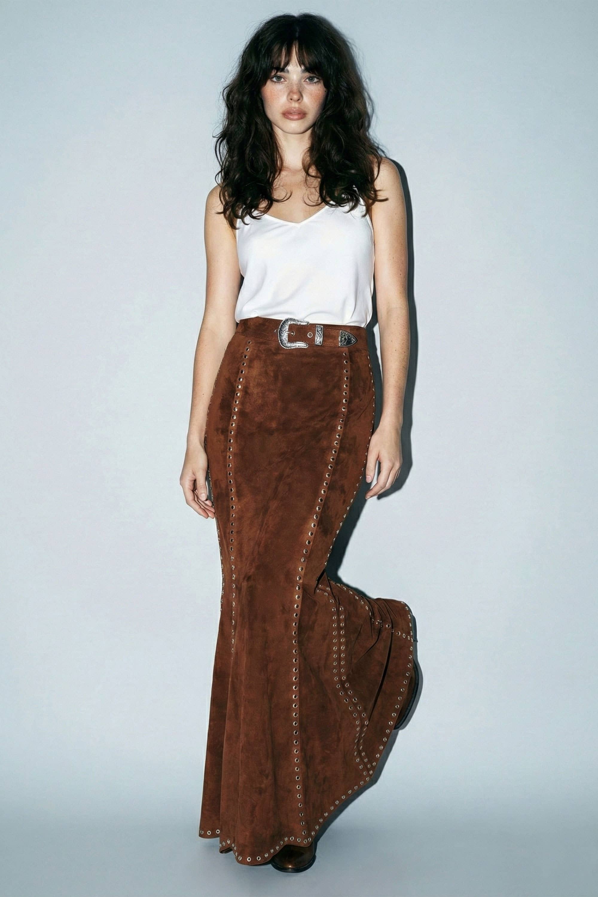 Skylar Rose suede studded maxi skirt with a flowing design and silver stud embellishments on soft suede fabric.