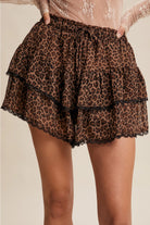 Leopard tiered ruffle lace trim skort from RARA Boutique, featuring layered fabric and decorative lace accents.