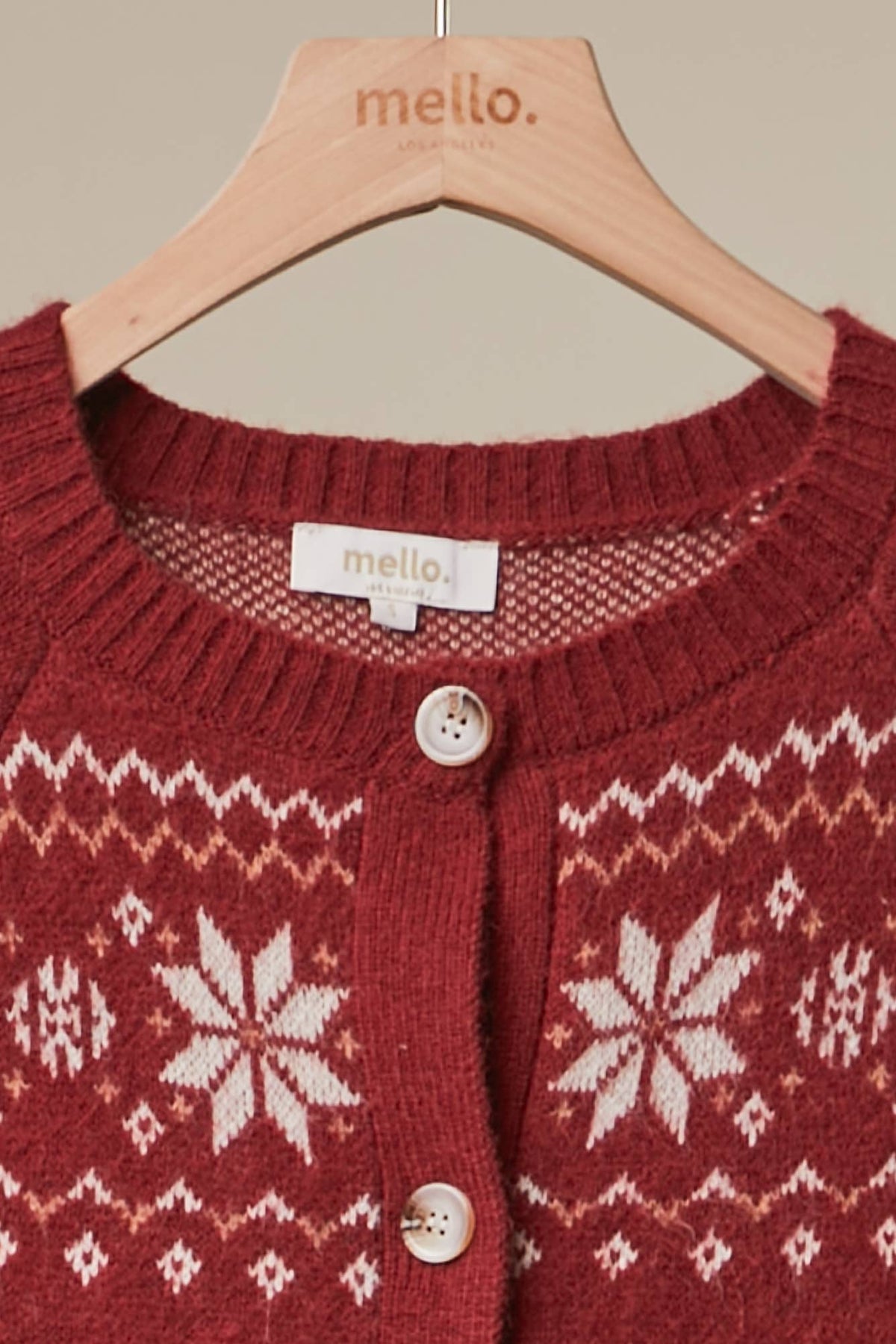 Mello Reindeer Fair Isle knit cardigan featuring festive reindeer and snowflake patterns in cozy winter style.