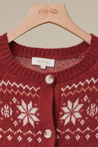 Mello Reindeer Fair Isle knit cardigan featuring festive reindeer and snowflake patterns in cozy winter style.