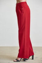 High waist tailored wide-leg trousers with button details from RARA Boutique, featuring a sleek fit and classic design.