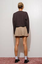 Pretty Garbage Kaina Martini sweater, cozy knit in a stylish design, shown on a model with a neutral background.