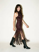 Skylar Rose high neck fringe dress with Western buckle belt, featuring flowing fringes and stylish western-inspired details.