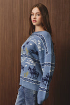 Long sleeve crew neck cowboy graphic sweater by LE LIS, featuring a detailed cowboy design on soft knit fabric.