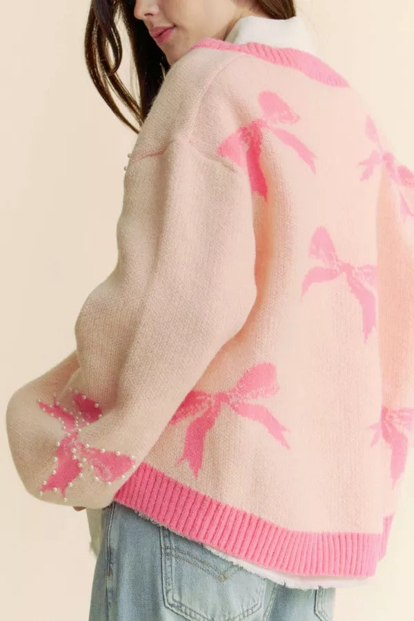 Pearl studded bow balloon sleeve V-neck sweater in soft knit, stylish and cozy from RARA Boutique.