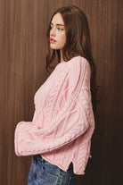 Le Lis oversized cropped cable knit sweater featuring chunky knit pattern and relaxed fit in a cozy, stylish design.