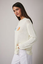 Lightweight knit sweater with coastal seashell pattern from RARA Boutique, featuring soft fabric and casual fit.