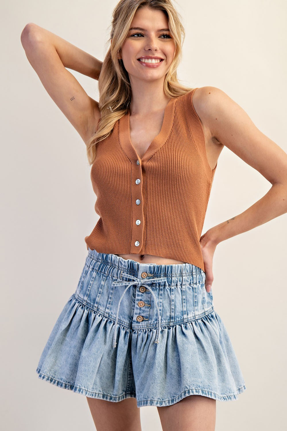 RARA Boutique DELETE ruffle flared denim mini skirt with elastic waist, showing the stylish ruffle detail and casual fit.
