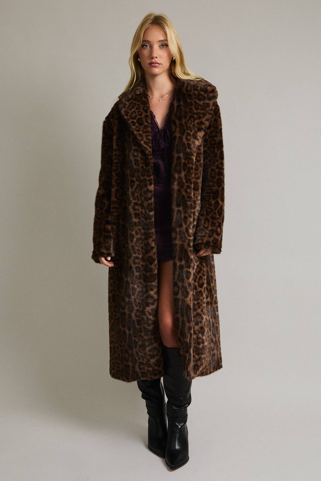 LE LIS faux fur long coat jacket with plush, luxurious texture, stylishly draped on a hanger.