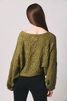 Le Lis long sleeve crochet cardigan featuring intricate knit pattern and open front design, perfect for layered fall outfits.