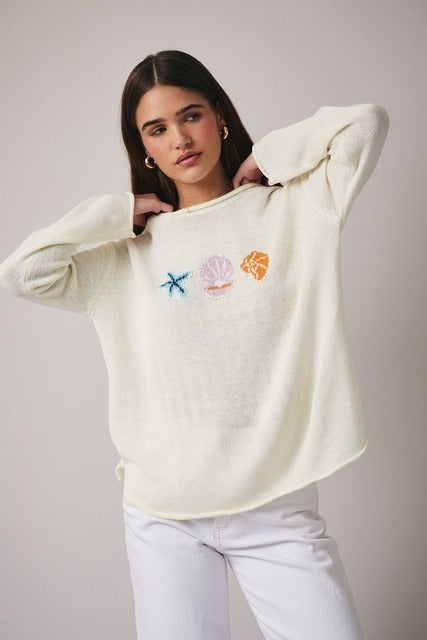 RARA Boutique Coastal Seashell lightweight knit sweater in soft fabric, featuring seashell patterns and a cozy fit.
