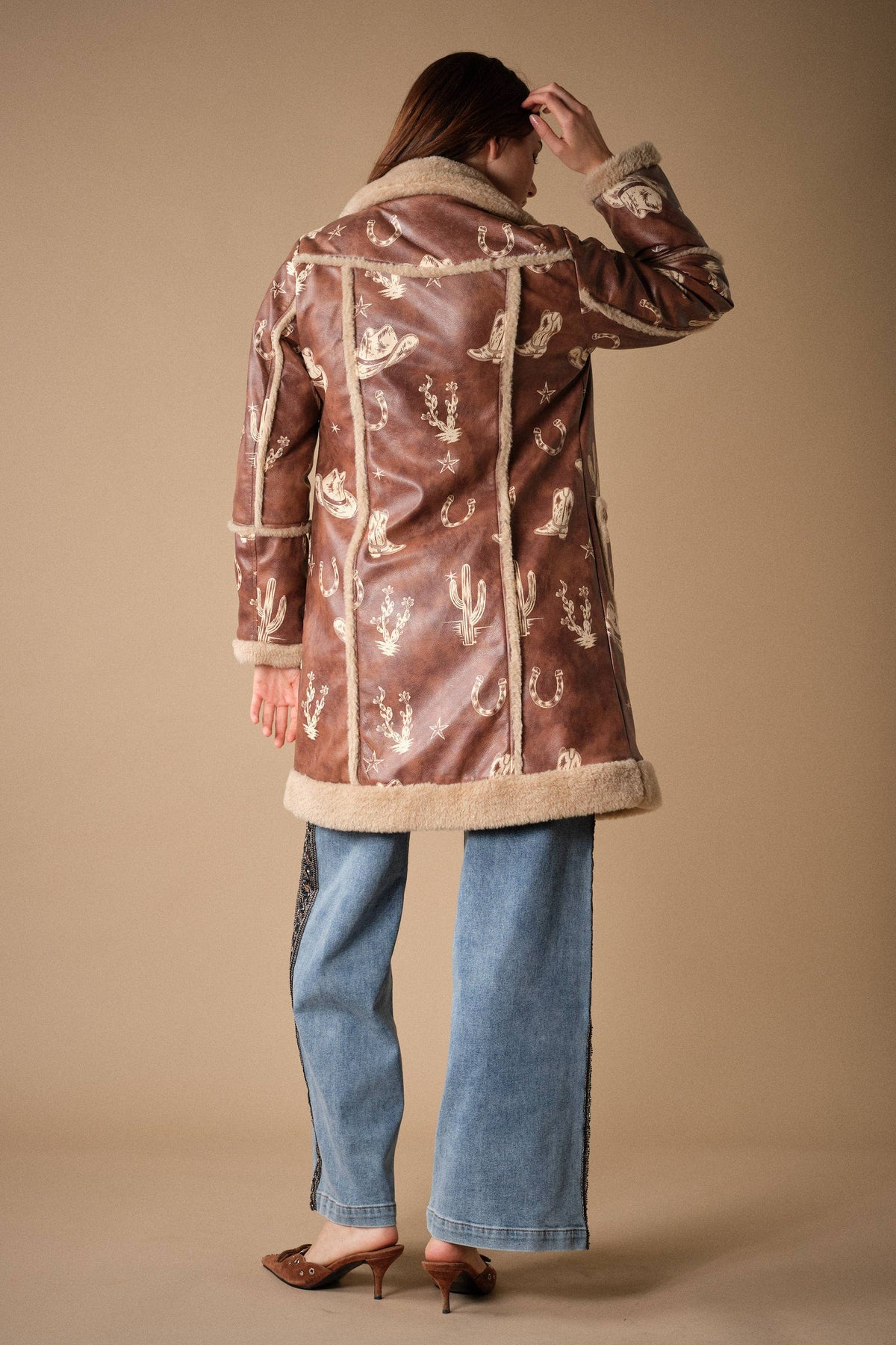 Blue B Western printed faux leather coat with stylish design, shown in a front view highlighting the detailed print and classic silhouette.