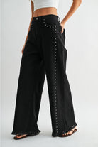 RARA Boutique studded ultra wide leg washed jeans with distressed details and a relaxed fit, showcasing the trendy denim style.