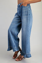 Ruffle hem wide-leg mineral washed jeans from RARA Boutique, showcasing relaxed fit and stylish design details.