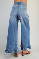 Ruffle hem wide leg mineral washed jeans by RARA Boutique featuring a relaxed fit and distressed details.
