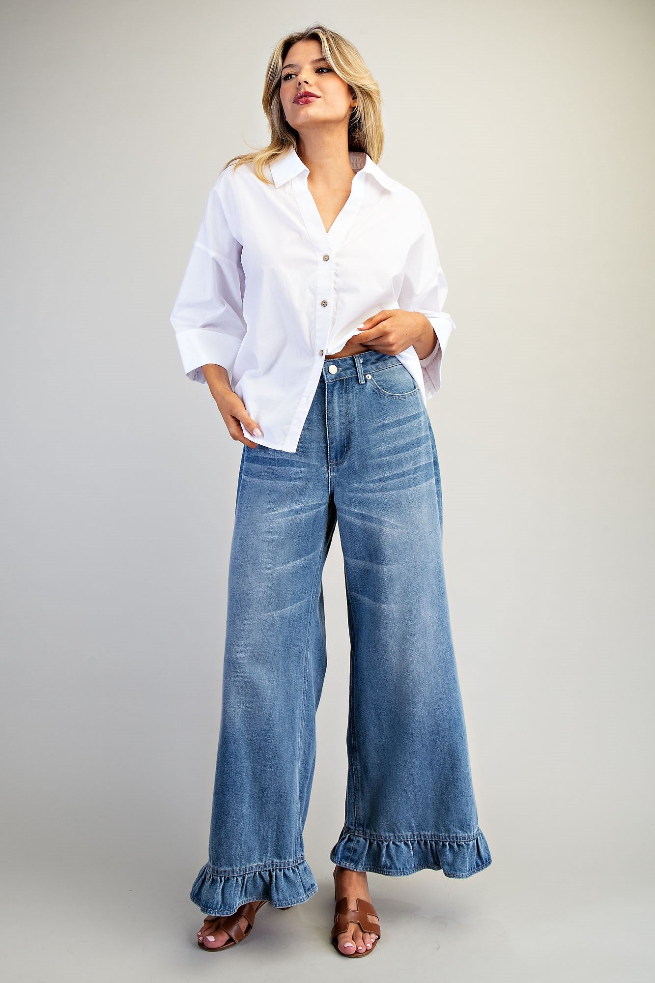 RARA Boutique mineral washed wide-leg jeans with ruffle hem, featuring a relaxed fit and stylish distressed details.