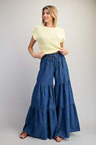 RARA Boutique mineral washed denim palazzo pants with tiered wide-leg design, ultra-wide fit, and stylish relaxed silhouette.