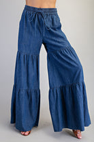 RARA Boutique mineral washed denim palazzo pants with wide, tiered ultra-wide legs and relaxed fit.