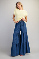 RARA Boutique mineral washed denim palazzo pants with tiered ultra-wide legs, styled for a relaxed, fashionable look.